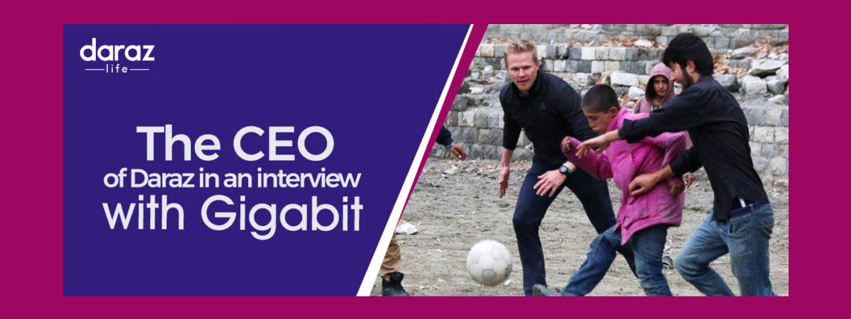 Daraz CEO Bjarke Mikkelsen playing soccer with local kids